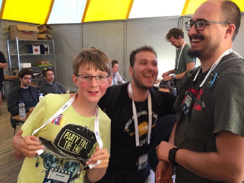 Happy badge owners inside the badge bar tent.